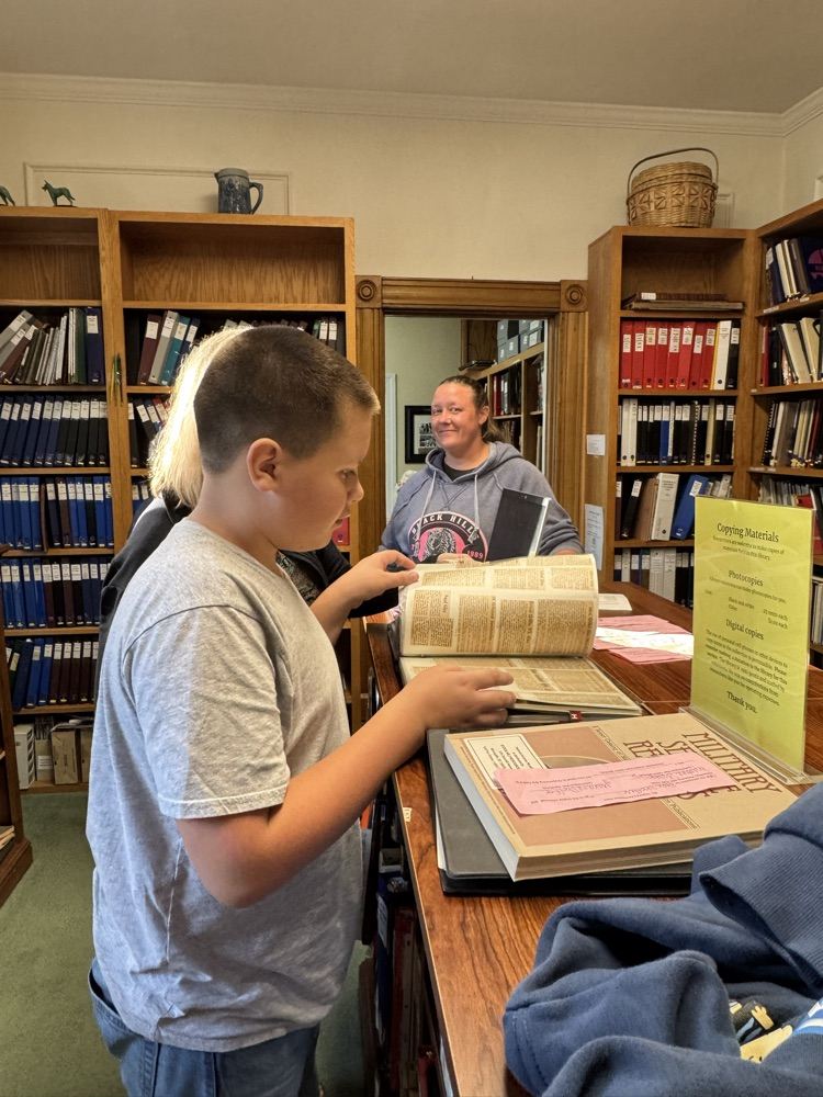 student looking at documents 