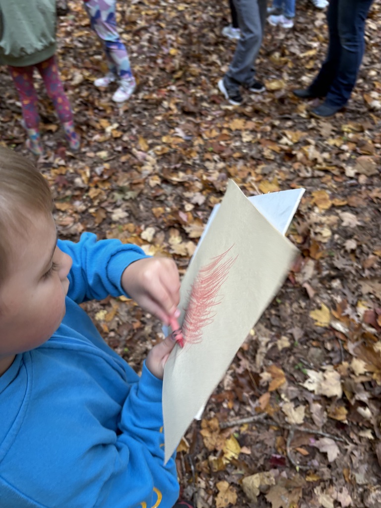 students using a crayon for a leaf running