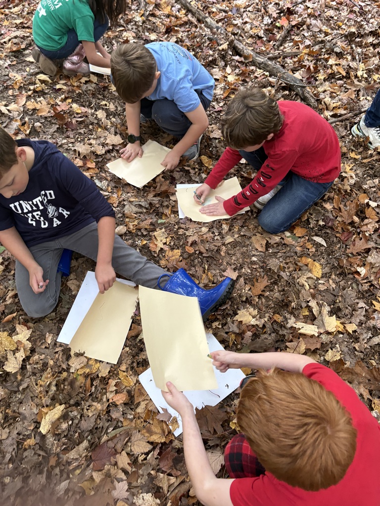 students writing on papers