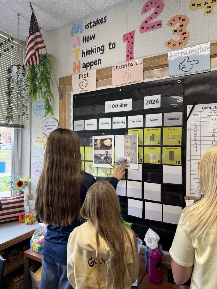 students looking at social studies images
