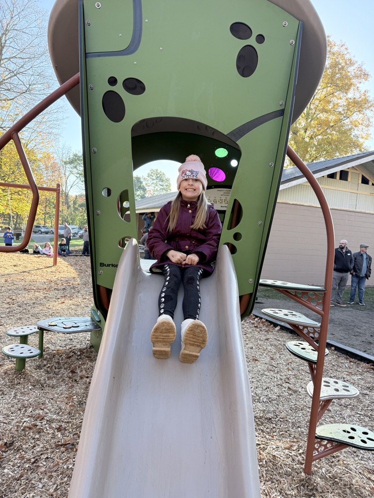 Student going down the slide.