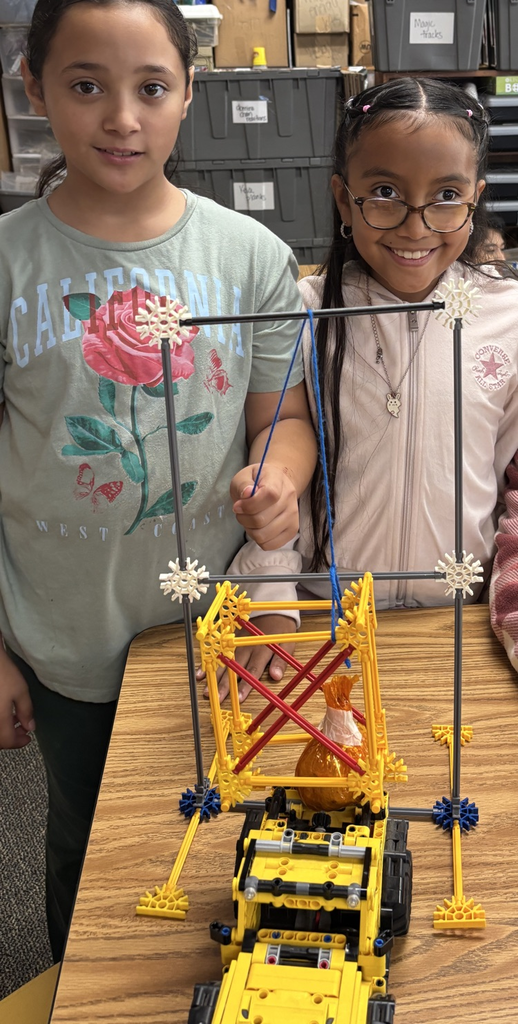 students with pumpkin pulley system 