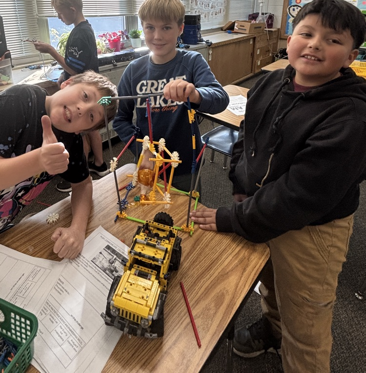 students with pumpkin pulley system 