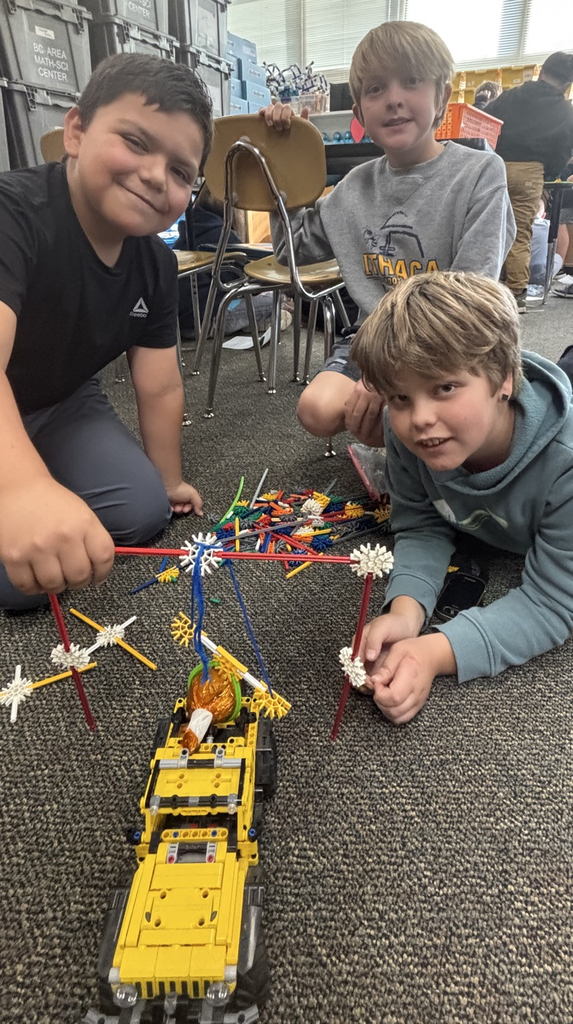students with pumpkin pulley system 