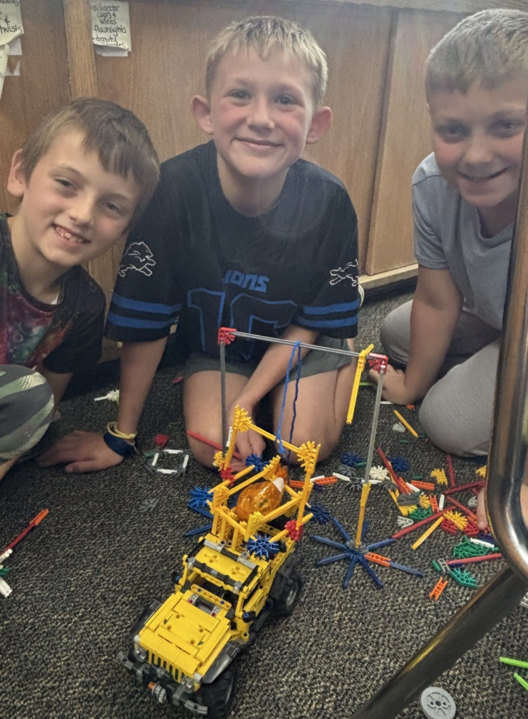 students with pumpkin pulley system 