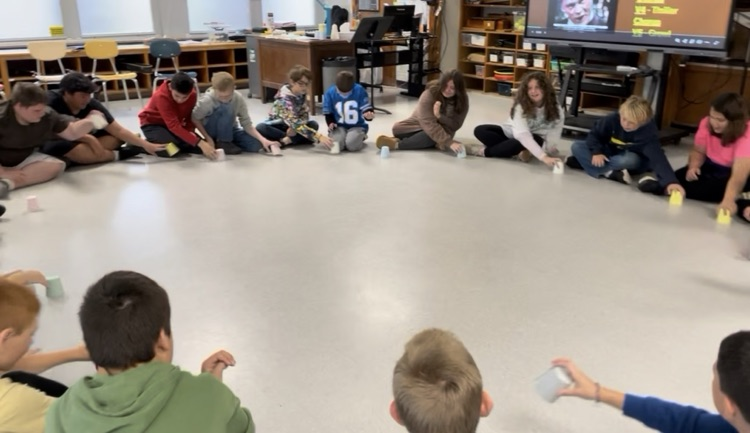 students sitting in a circle 