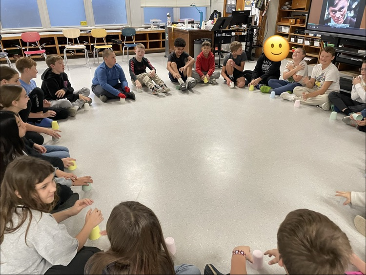 students sitting in a circle 
