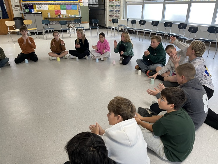 students sitting in a circle 