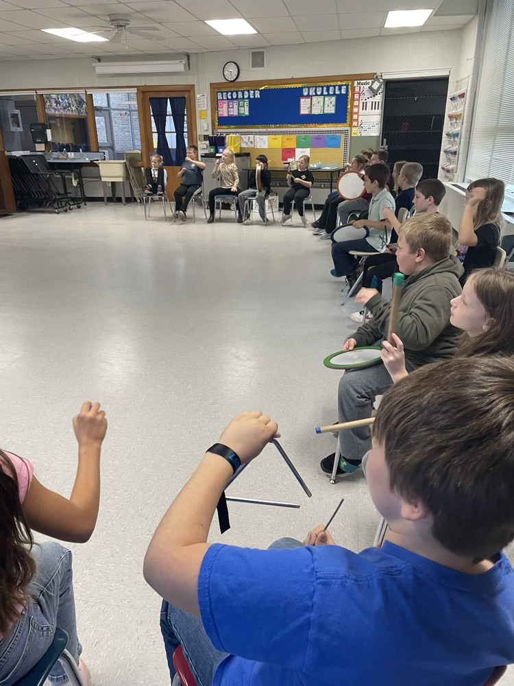 students playing percussion instruments