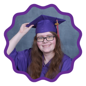 student in her graduation cap and gown smiling 