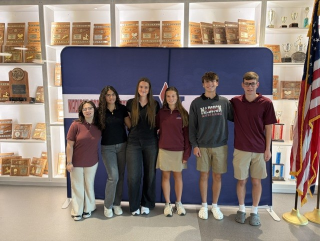 MAHS Leadership University Participants: 6 students in front of the MAHS backdrop. 