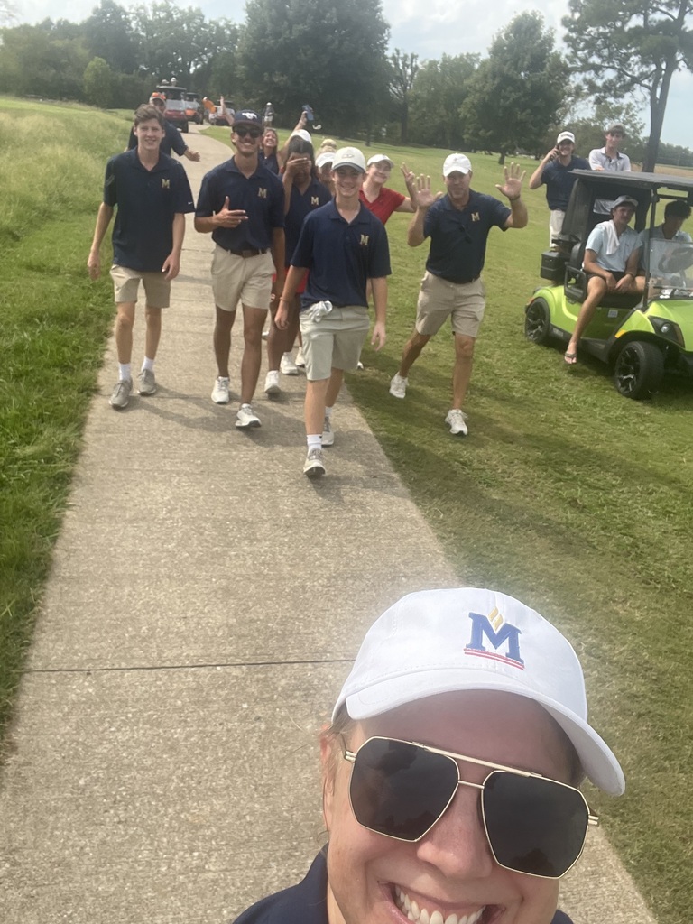 Golf Team walking down sidewalk