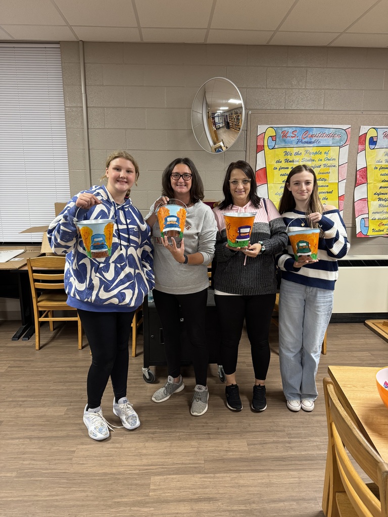 Families painting in a family paint night hosted by Partners for Rural Impact.