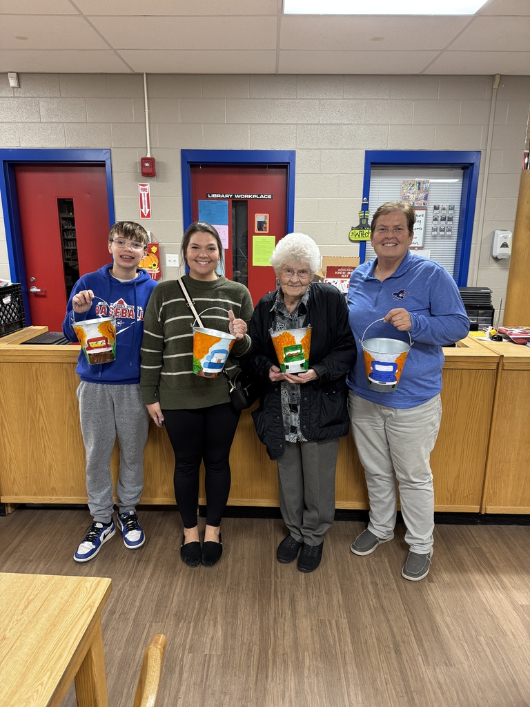 Families painting in a family paint night hosted by Partners for Rural Impact.