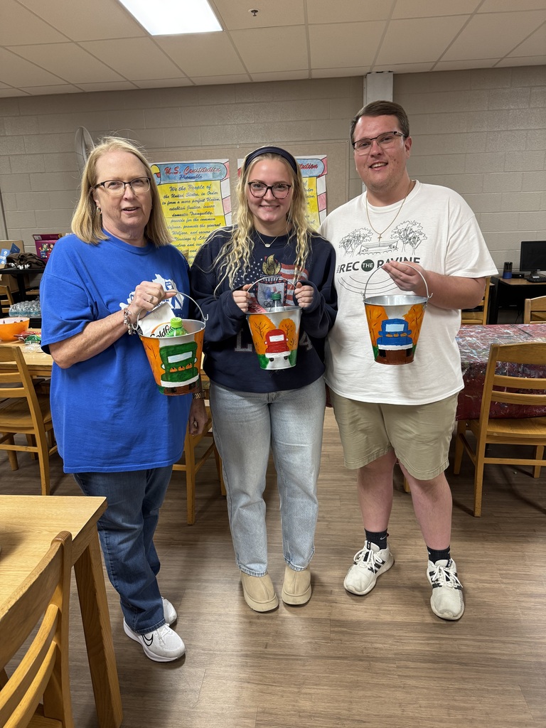 Families painting in a family paint night hosted by Partners for Rural Impact.