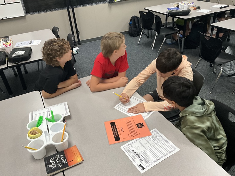 4 boys working together