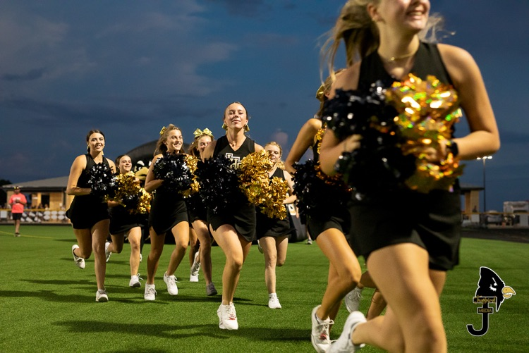 The Varsity Cheer squad running out of the tunnel to lead the fans!