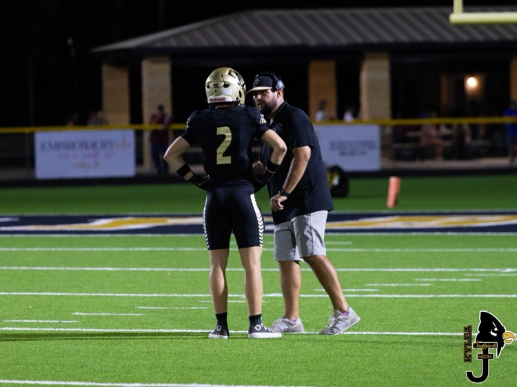 Coach Stanaland talking with Bode Ham
