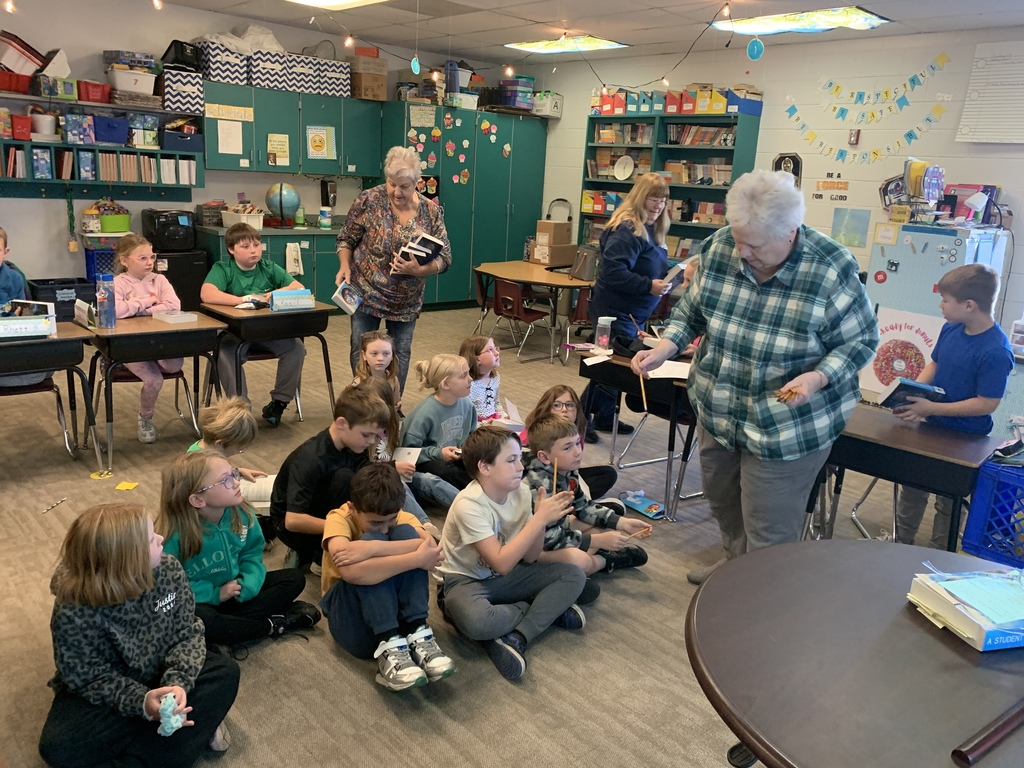 Third graders receiving their dictionaries