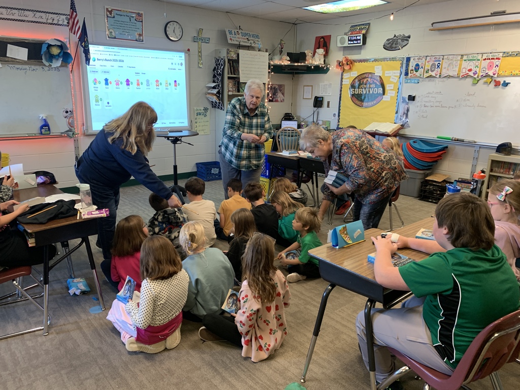 Third graders receiving their dictionaries