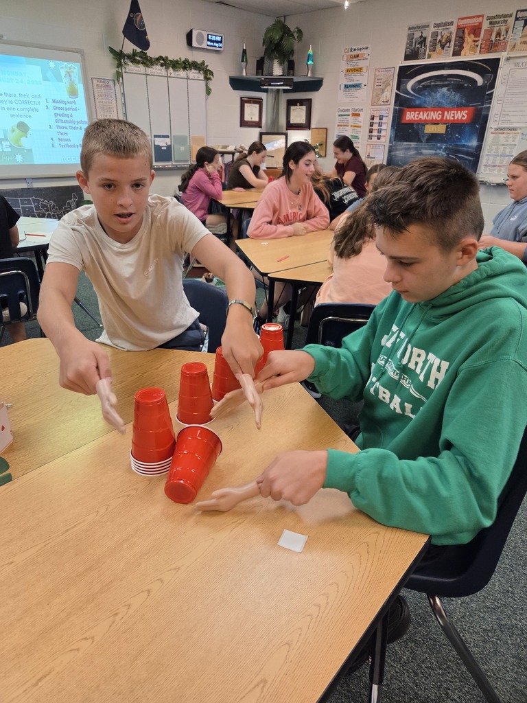 Blindfolded or using tiny hands to stack cups.