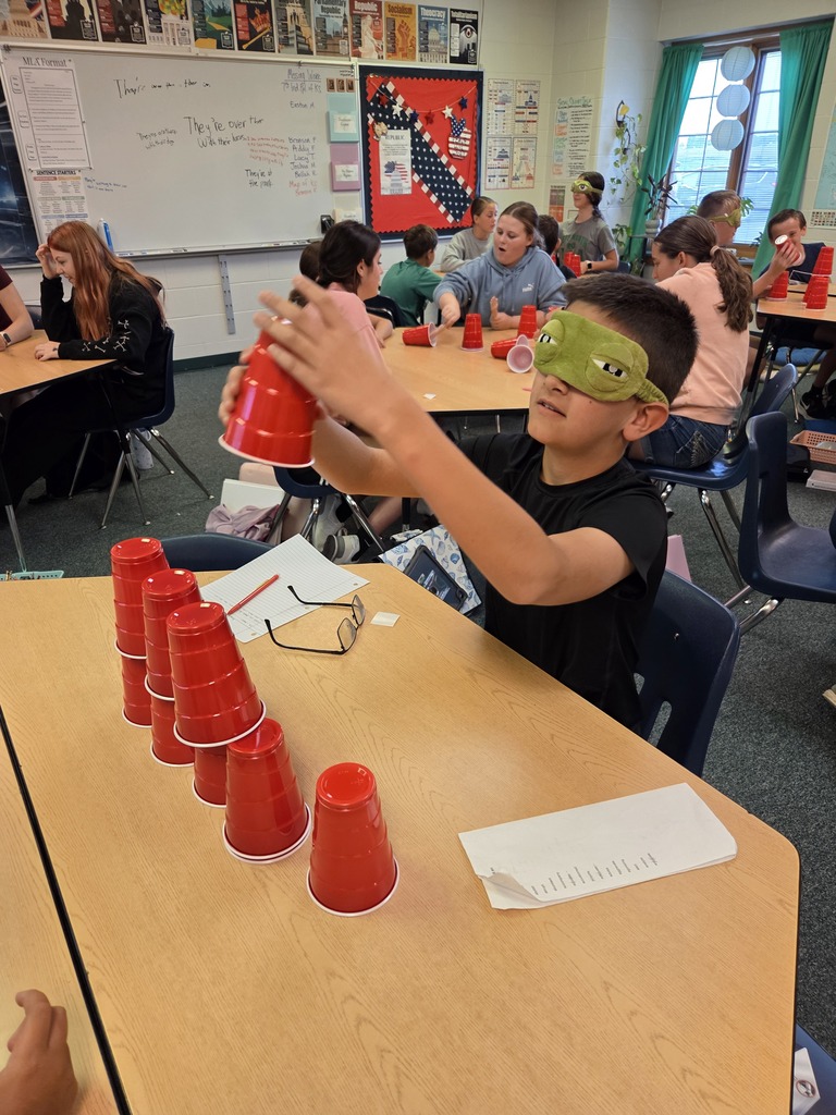 Blindfolded or using tiny hands to stack cups.