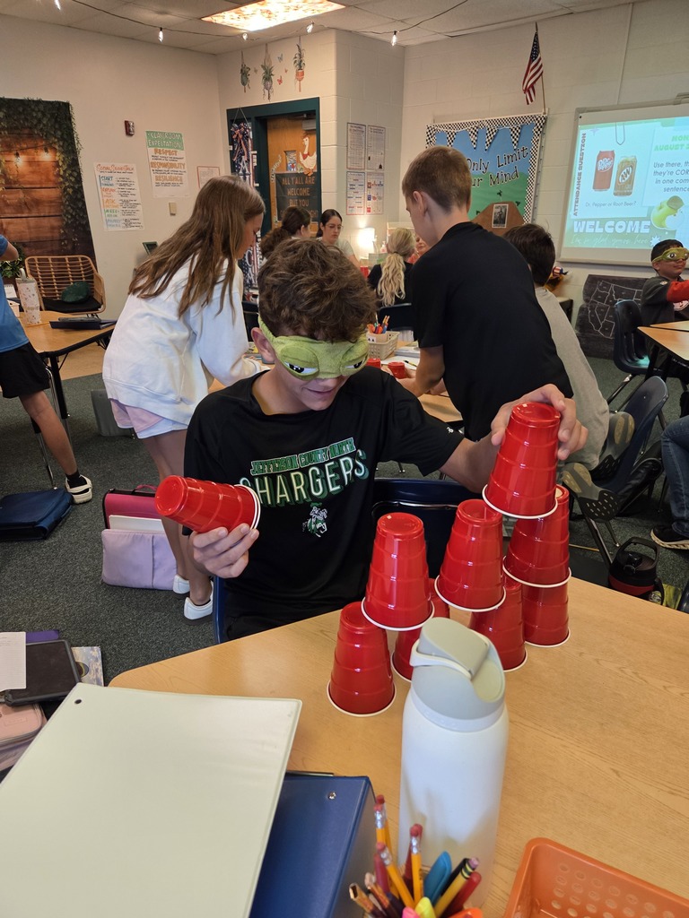 Blindfolded or using tiny hands to stack cups.