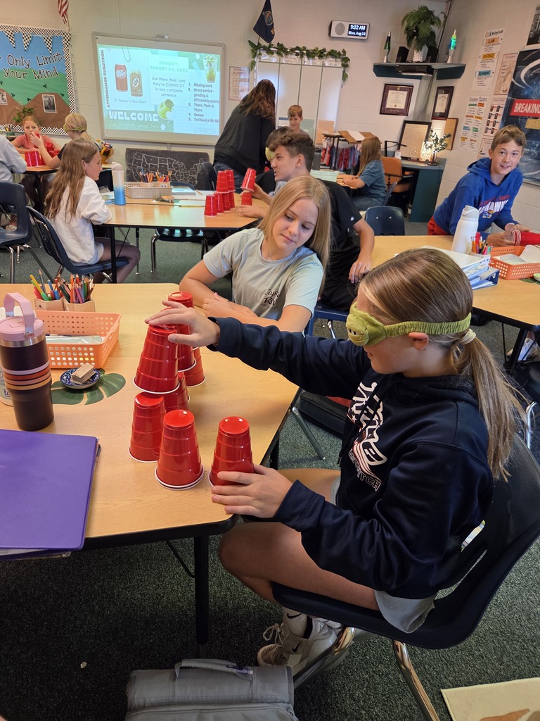 Blindfolded or using tiny hands to stack cups.