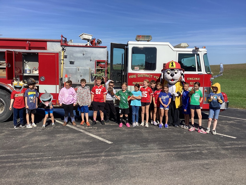 Students in front of a fire truck.