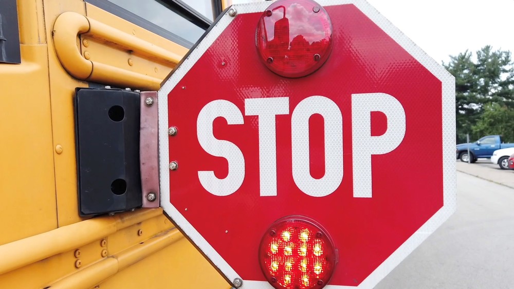 School bus with stop sign out