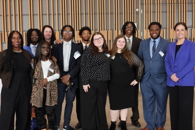 A group of students and staff standing with the Lt Governor