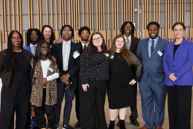 A group of students and staff standing with the Lt Governor