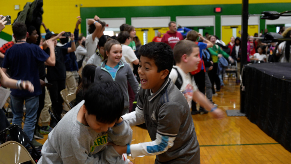 Kids jumping around smiling with excitment