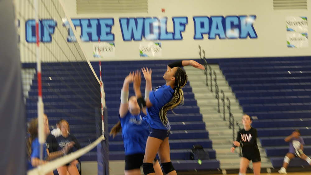 Girl about to hit a volleyball