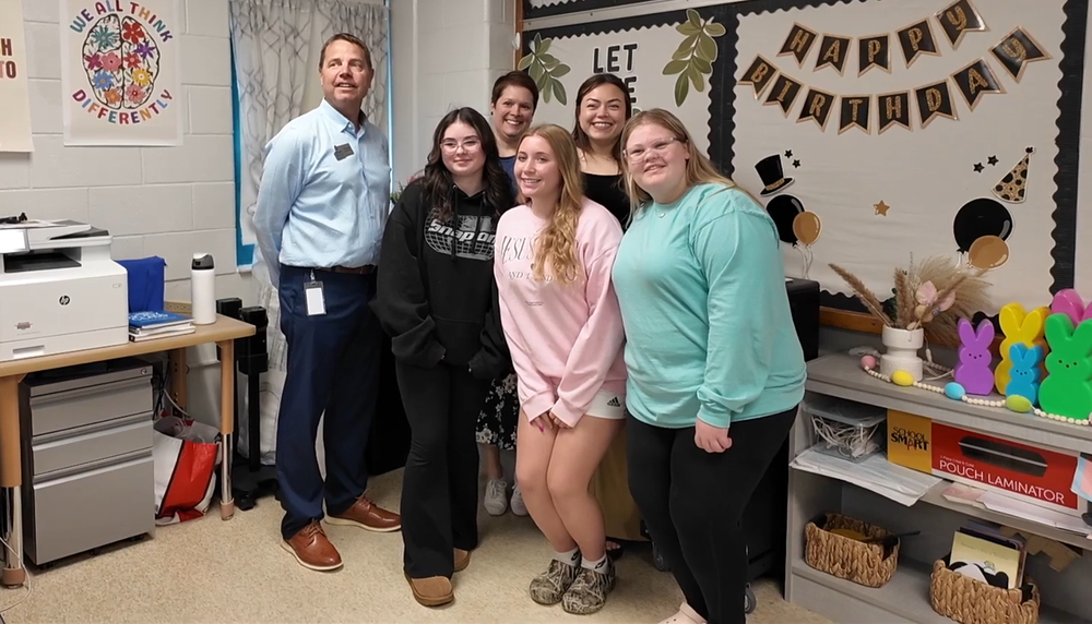 Three students in teacher apprenticeship program with three JCPS staff