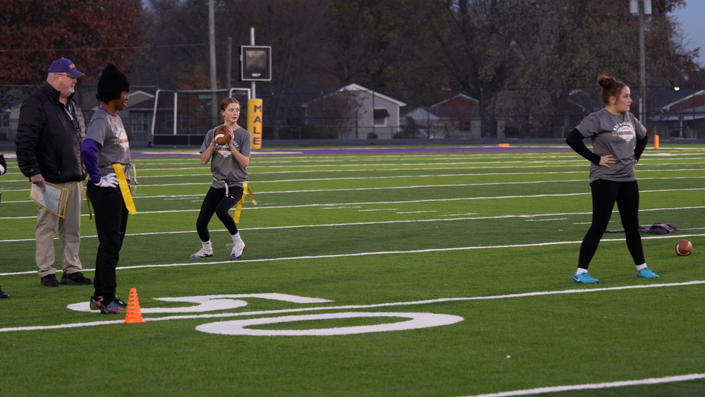 Girl about to throw a football