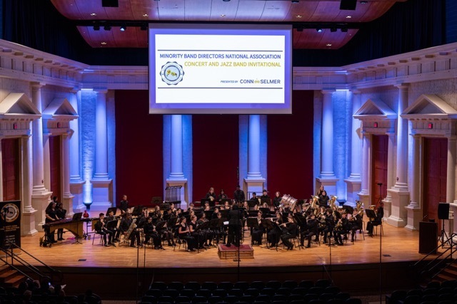 Band performing on stage at Minority Band Directors National Association