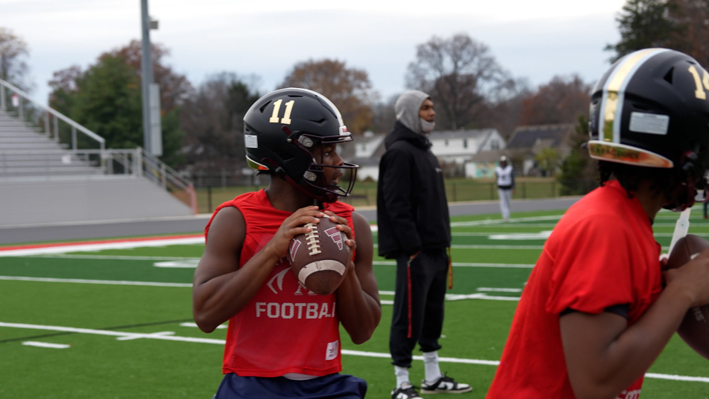 Football player about to throw a football