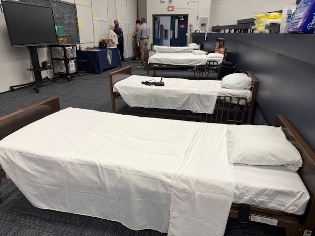 Donated hospital beds in room at Moore High School