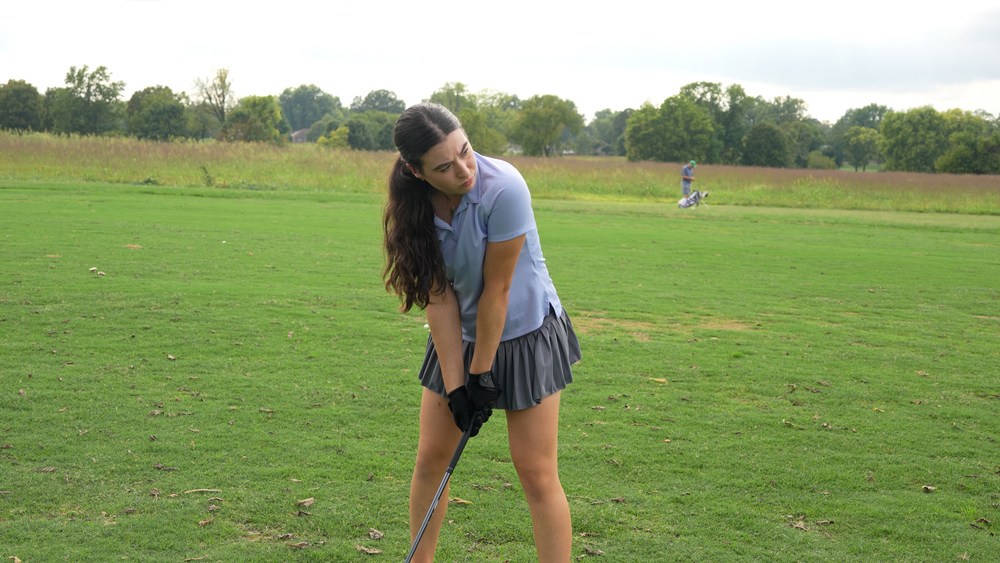 Ella Sizemore, Manual golfer, about to hit a golf ball