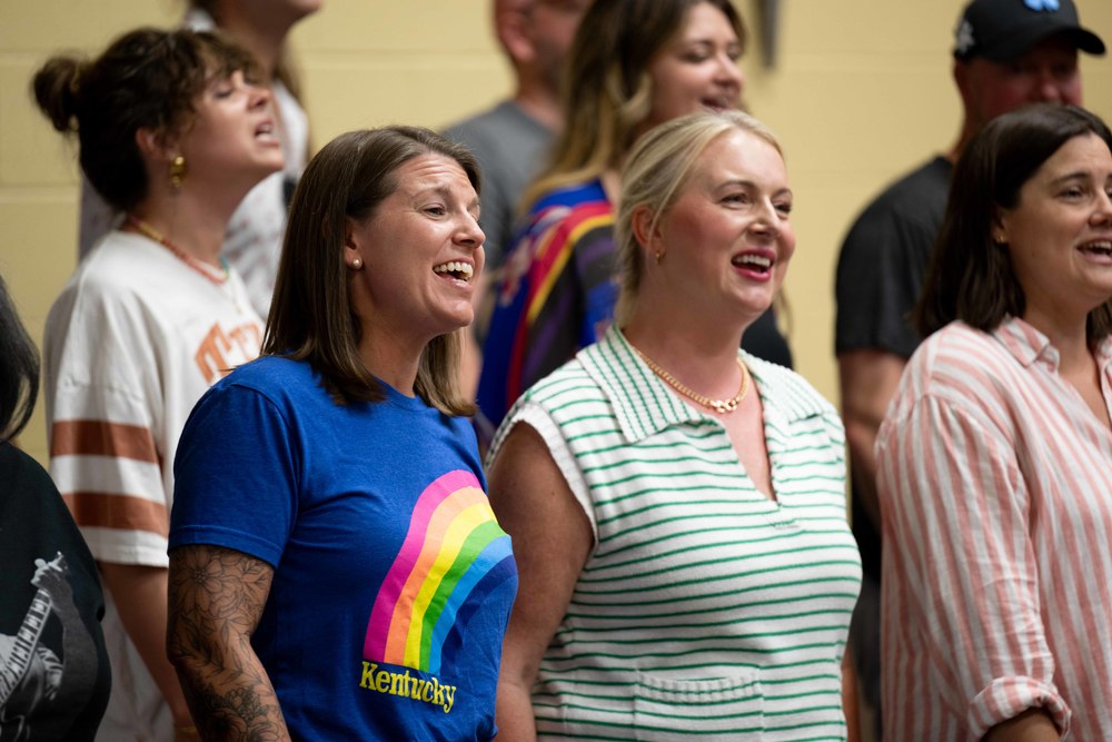 Women singing during choir practice.