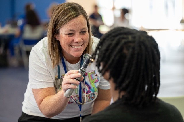 Nurse examining patient