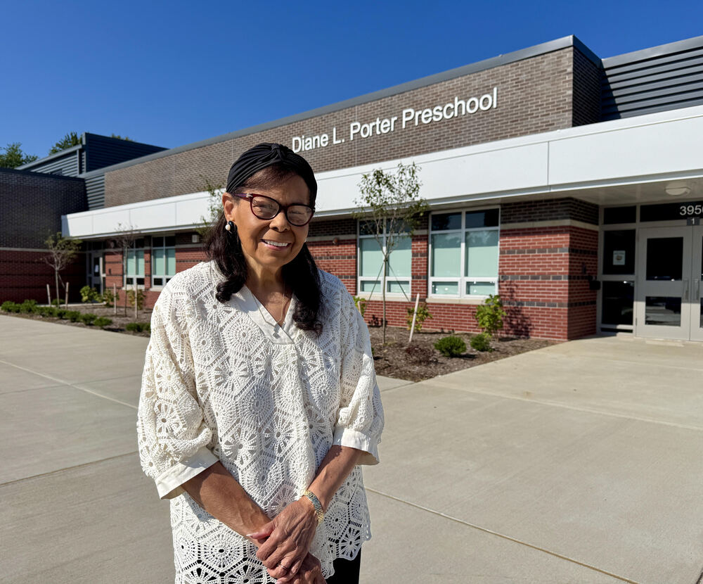 Diane Porter stands in front of the Diane L. Porter Preschool building.