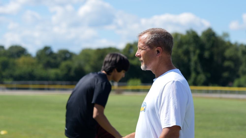 Valley head boy's soccer coach James Wise looking at his team warming up