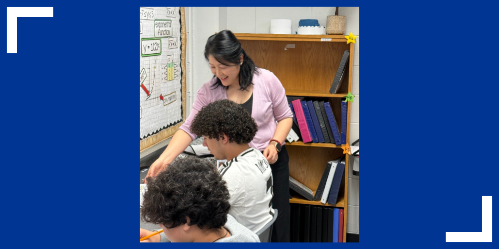 Hui Couch teaches students in a classroom.