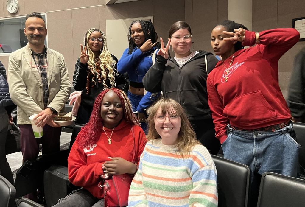 students and teachers at the movie theater