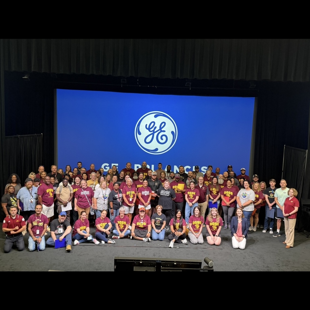 Doss High School staff in front of GE Appliances screen