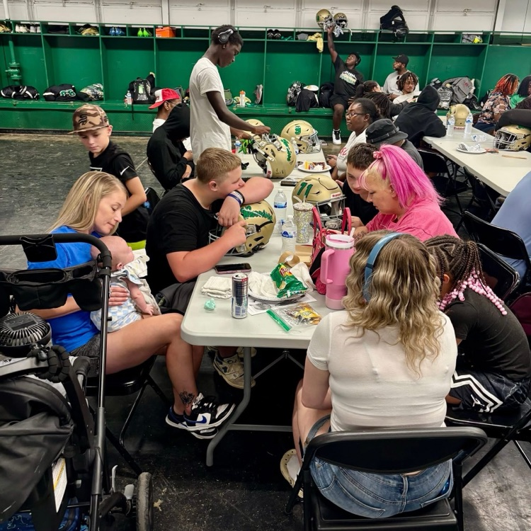 Photo of players putting decals on helmets