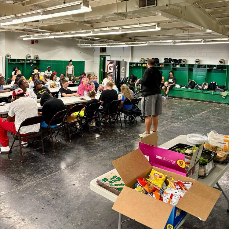 Photo of players putting decals on helmets