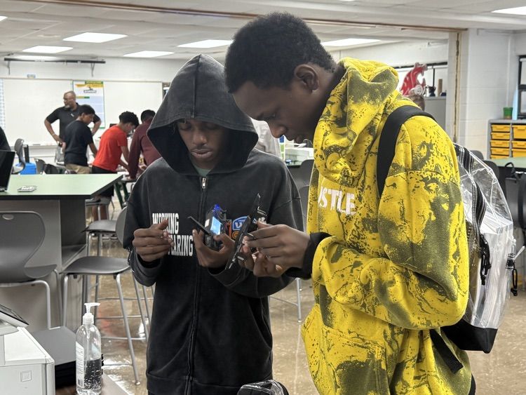 Photo of students and their drone